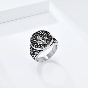 Detailed view of vintage Masonic Freemason ring with G symbol and sparkling stones