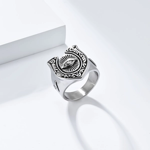 Macro detail of retro horseshoe eye totem on a wide titanium steel ring for men
