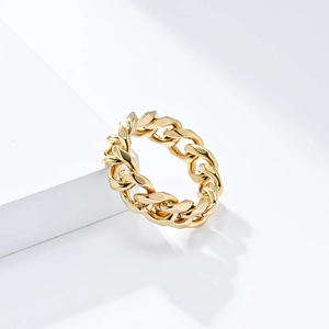 Minimalist gold-plated stainless steel chain ring shown on a white geometric block