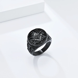 Detailed macro view of matte black Freemason ring with G logo and white zircon stone