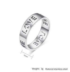 Detail view of 6mm wide stainless steel ring featuring cutout LOVE letter pattern