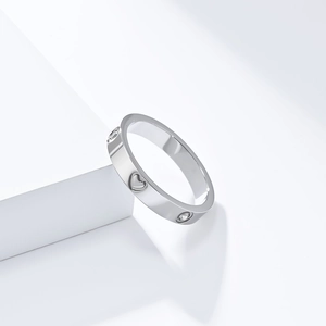 Silver stainless steel heart ring with cubic zirconia stones in a luxury minimalist style