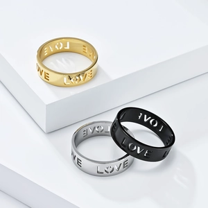 Set of minimalist stainless steel rings with LOVE hollow design in gold, silver, and black