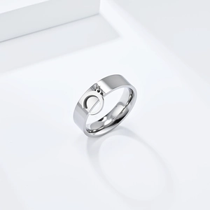 Minimalist silver titanium steel ring with moon cutout design and circular charm pendant