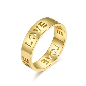Polished gold stainless steel wide ring with LOVE镂空 design on white background