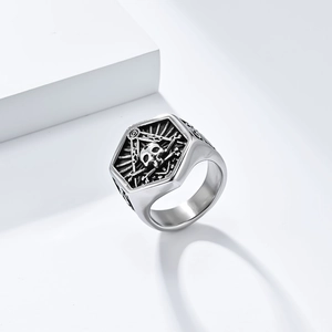 Macro view of retro stainless steel skull ring with masonic symbol and vintage engraving