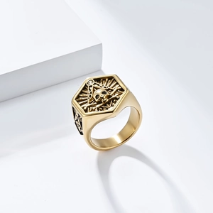 Macro shot of gold Masonic skull signet ring featuring radiant texture and punk details