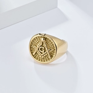 Polished gold Freemasonry signet ring featuring masonic compass and square G symbol