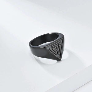 Macro detail of black Valknut signet ring with matte finish and polished steel edges