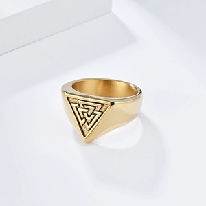 Gold stainless steel Viking Valknut signet ring with Odin triangle knot on white background