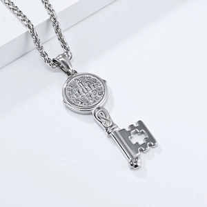 Detail of Saint Benedict medal key pendant with cross cutout and twisted rope chain