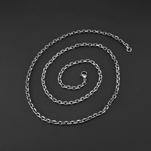 Unisex silver stainless steel O-chain necklace with lobster clasp on black background