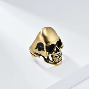 Matte brushed skull ring in golden titanium steel featuring realistic gothic details