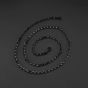 Detailed view of matte black stainless steel oval link chain with lobster clasp closure