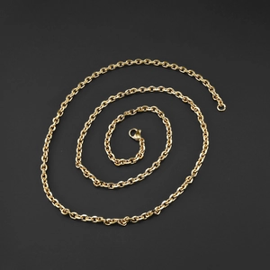 Macro view of gold stainless steel O-chain necklace with secure lobster clasp detail