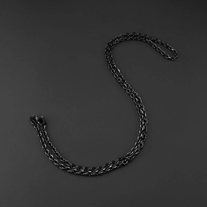 Detail of matte black stainless steel rolo chain necklace with secure lobster clasp closure
