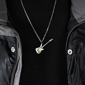 Unisex stainless steel electric guitar pendant necklace on black clothing background
