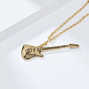 Close-up of golden electric guitar pendant showing detailed strings and hardware