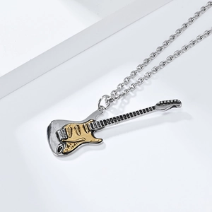 Detail of guitar necklace featuring two-tone silver and gold plated stainless steel finish