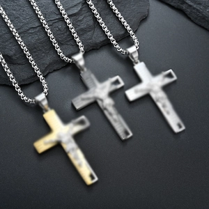 Set of three stainless steel cross necklaces in silver, black and gold tones with jesus relief