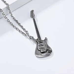 Close-up of a silver electric guitar pendant necklace with detailed stainless steel strings