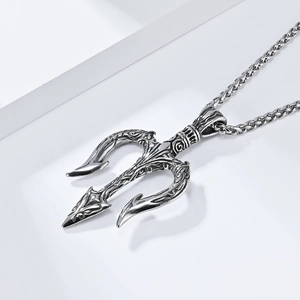 Detailed close-up of Poseidon trident pendant featuring vintage pattern and steel chain