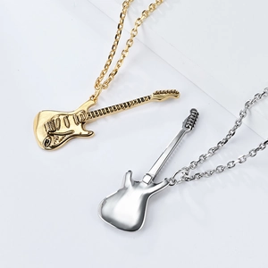 Close-up of gold and silver electric guitar pendants with high polished finish