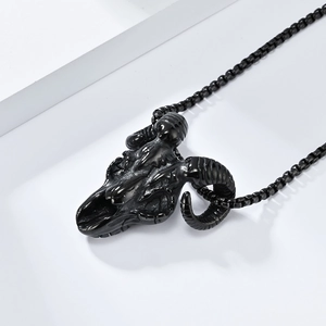 Detailed view of a gothic goat skull pendant in matte black stainless steel on white block