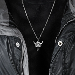 Unisex retro devil key pendant necklace in vintage silver steel on a stylish model