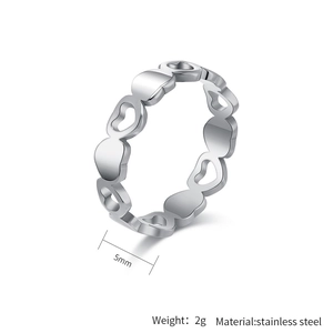 Macro shot of silver stainless steel heart ring with 5mm width and 2g weight specs
