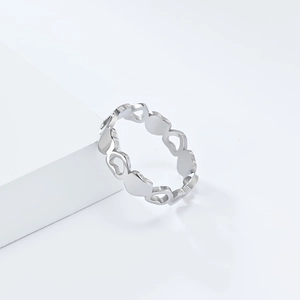 Close-up of hollow and solid heart pattern design on silver stainless steel ring