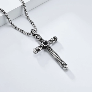 Gothic retro stainless steel cross necklace featuring skull details and a black gemstone