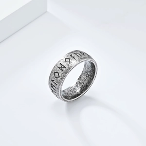 Detailed view of vintage Nordic Viking Rune carvings on aged silver finish stainless steel ring