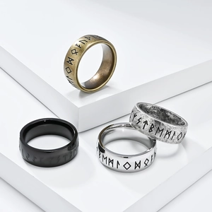 Vintage Viking Rune rings in bronze, silver, and black finishes on white display