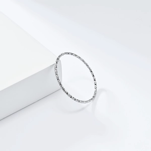 Minimalist silver textured stacking ring in stainless steel for a modern look