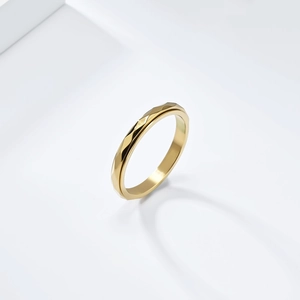 Minimalist gold stainless steel ring with diamond cut geometric surface design