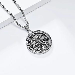 Detail view of Anubis and Ankh cross relief on a silver stainless steel pendant