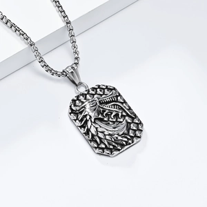 Vintage stainless steel dragon pendant necklace with embossed details on a white background