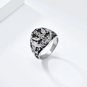 Detailed macro view of the double-headed eagle engraving and Ankh cross on the silver ring