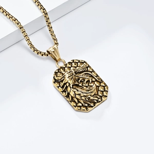 Vintage golden stainless steel necklace with dragon relief pendant on geometric stand