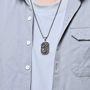 Vintage silver dragon pendant necklace with detailed relief carving for men