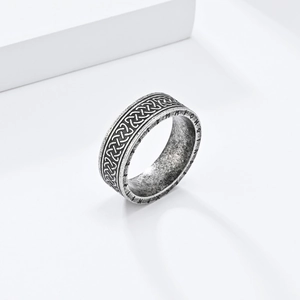 Detailed macro view of vintage silver Viking ring with Celtic knot and Nordic runes
