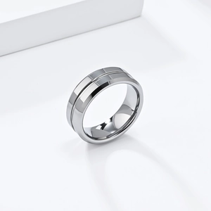Macro shot of 8mm tungsten ring showing polished mirror surface and bevelled edges
