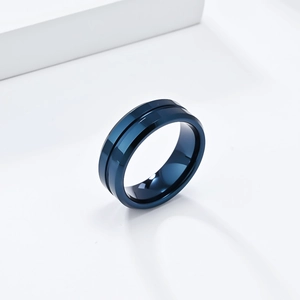 Polished deep blue 8mm tungsten steel ring with center groove on white pedestal