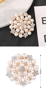 Detail showing elegant 5.5cm cluster brooch with pearls and floral crystals on gold base