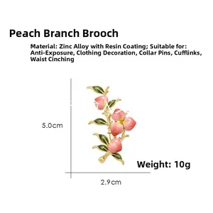 Detailed size view of peach branch brooch in zinc alloy with pink enamel and gold finish