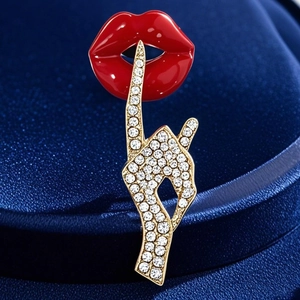 Elegant gold-tone red lip hush gesture brooch with pavé crystal hand for suit lapels