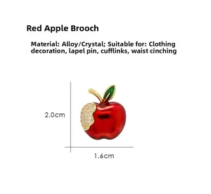 Close-up of a red apple brooch with rhinestones showing dimensions 2.0cm by 1.6cm