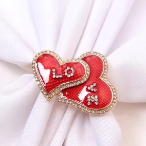 Elegant red heart napkin ring with LOVE lettering and crystals for table decor