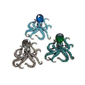 Macro detail of octopus pins featuring alloy bases and colorful micro-set rhinestones